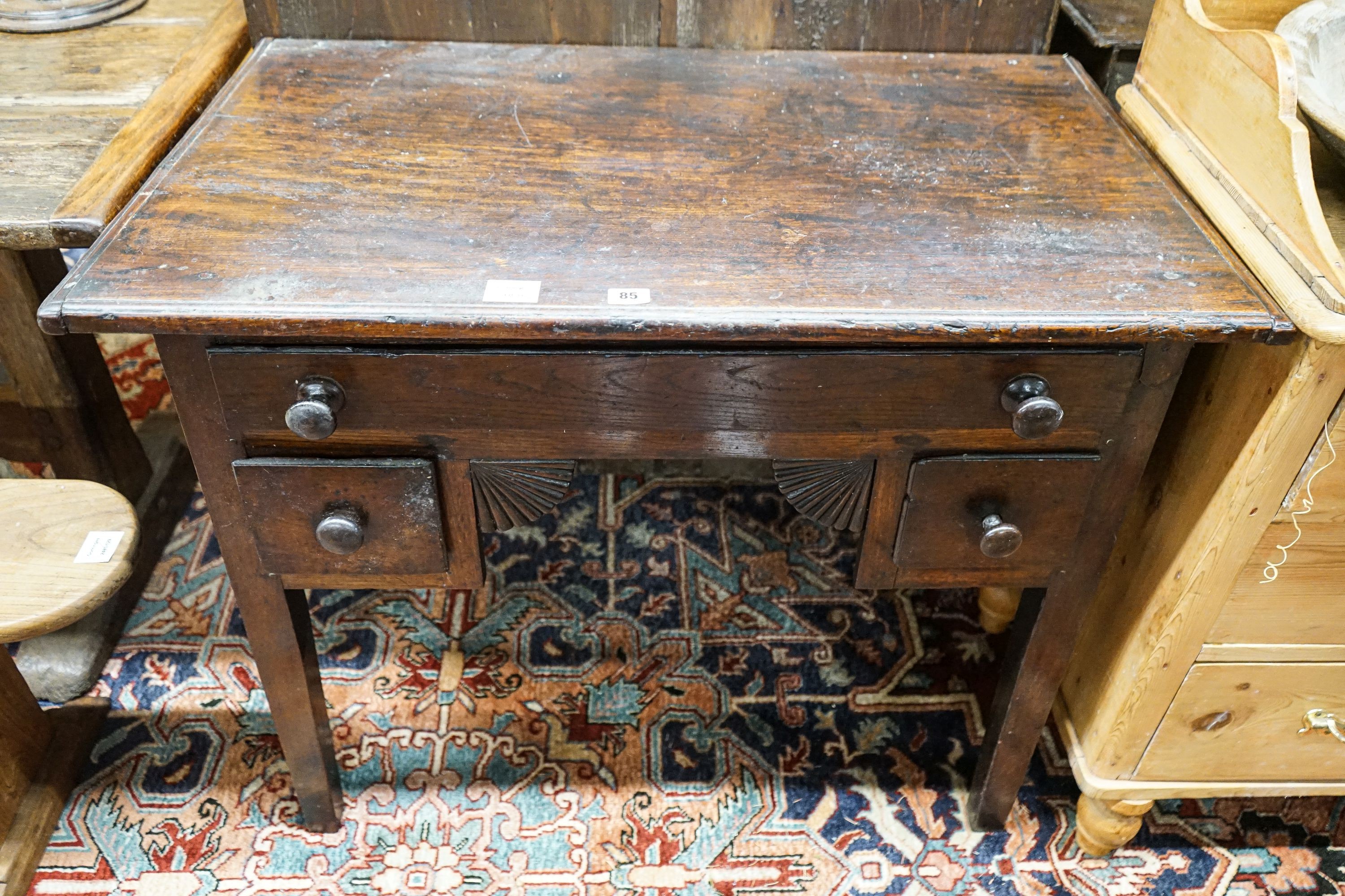 An early 19th century oak low boy, fitted three drawers, on square tapered legs, width 94cm, depth 55cm, height 77cm